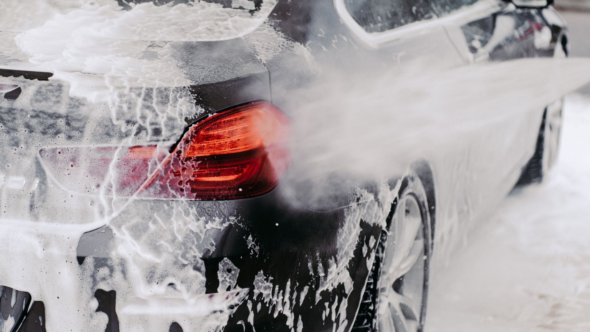 Exterior car detailing with waxing and trim restoration